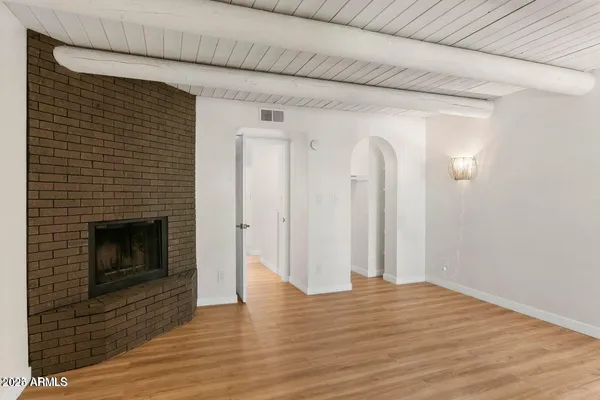 a view of a livingroom with wooden floor