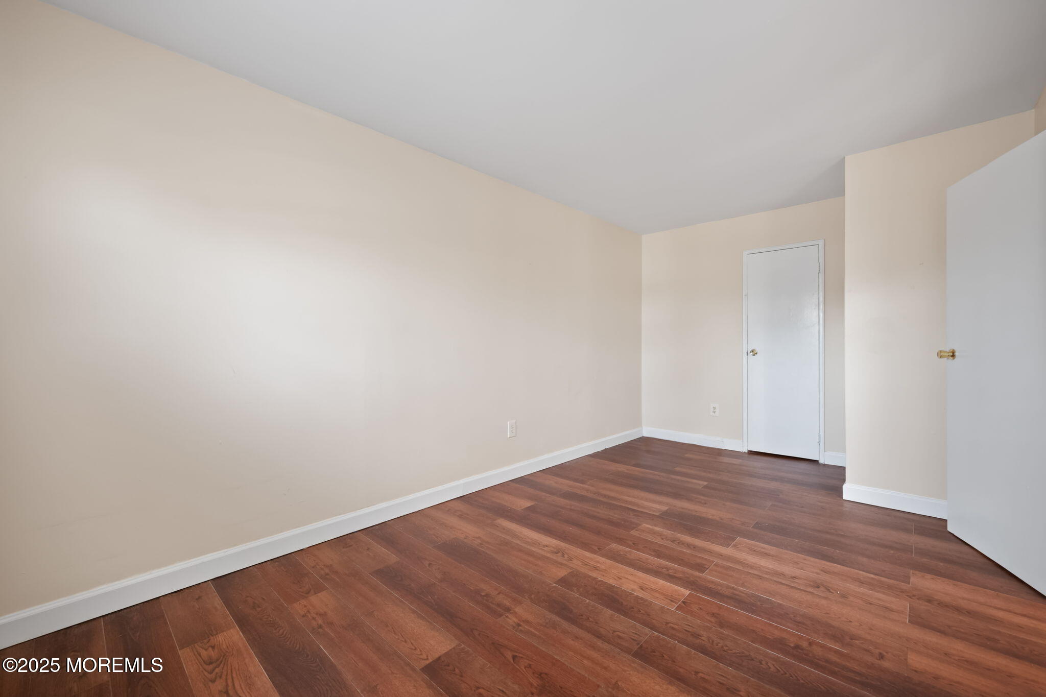175 Buckelew Avenue, Unit BLDG 4 10 Jamesburg, NJ 08831 - Photo 6 of 31 a view of an empty room with wooden floor