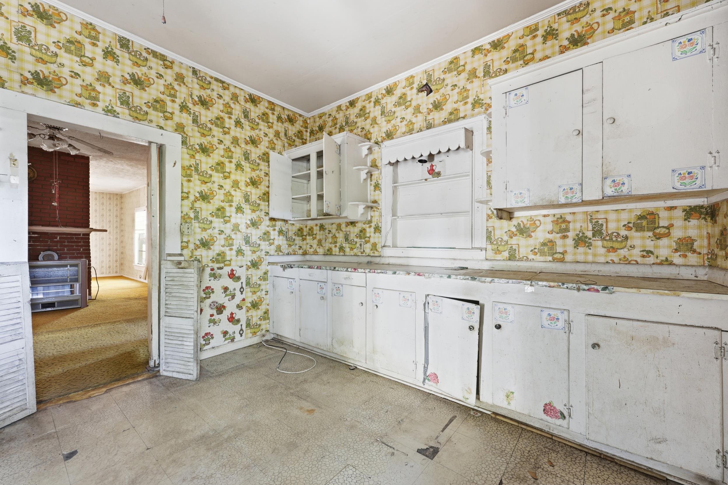 9 Masters Drive St. Augustine, FL 32084 - Photo 11 of 39 a kitchen with granite countertop white cabinets and sink