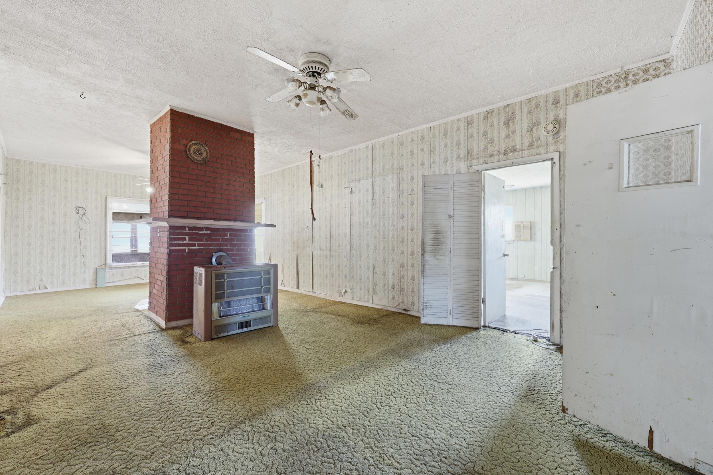 9 Masters Drive St. Augustine, FL 32084 - Photo 4 of 39 a view of an empty room with chandelier fan