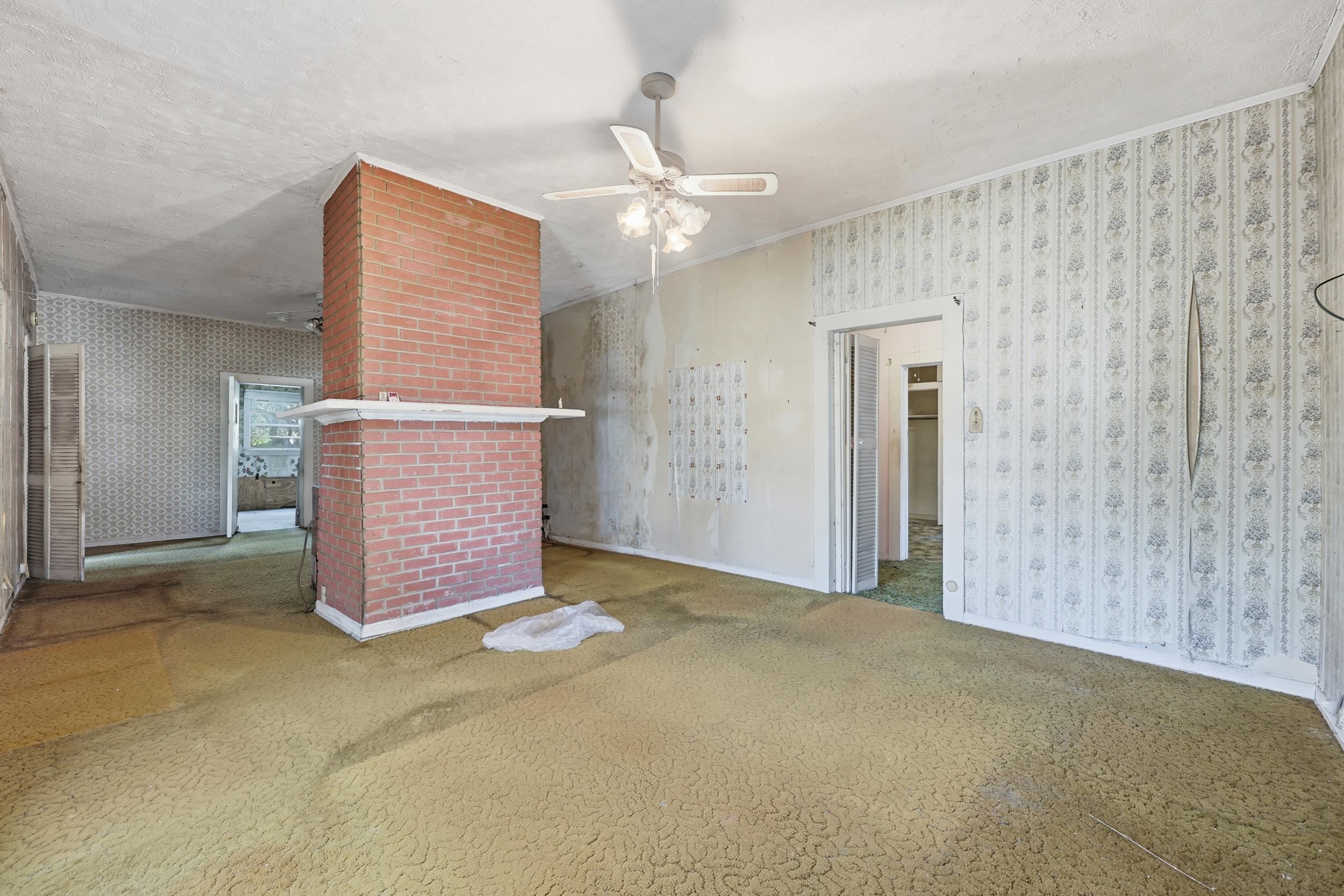 9 Masters Drive St. Augustine, FL 32084 - Photo 6 of 39 a view of an empty room with chandelier fan