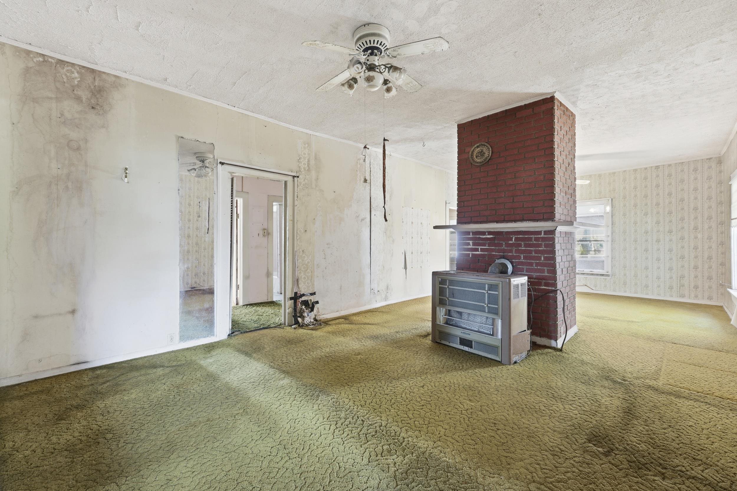 9 Masters Drive St. Augustine, FL 32084 - Photo 7 of 39 a view of an empty room with furniture and a ceiling fan