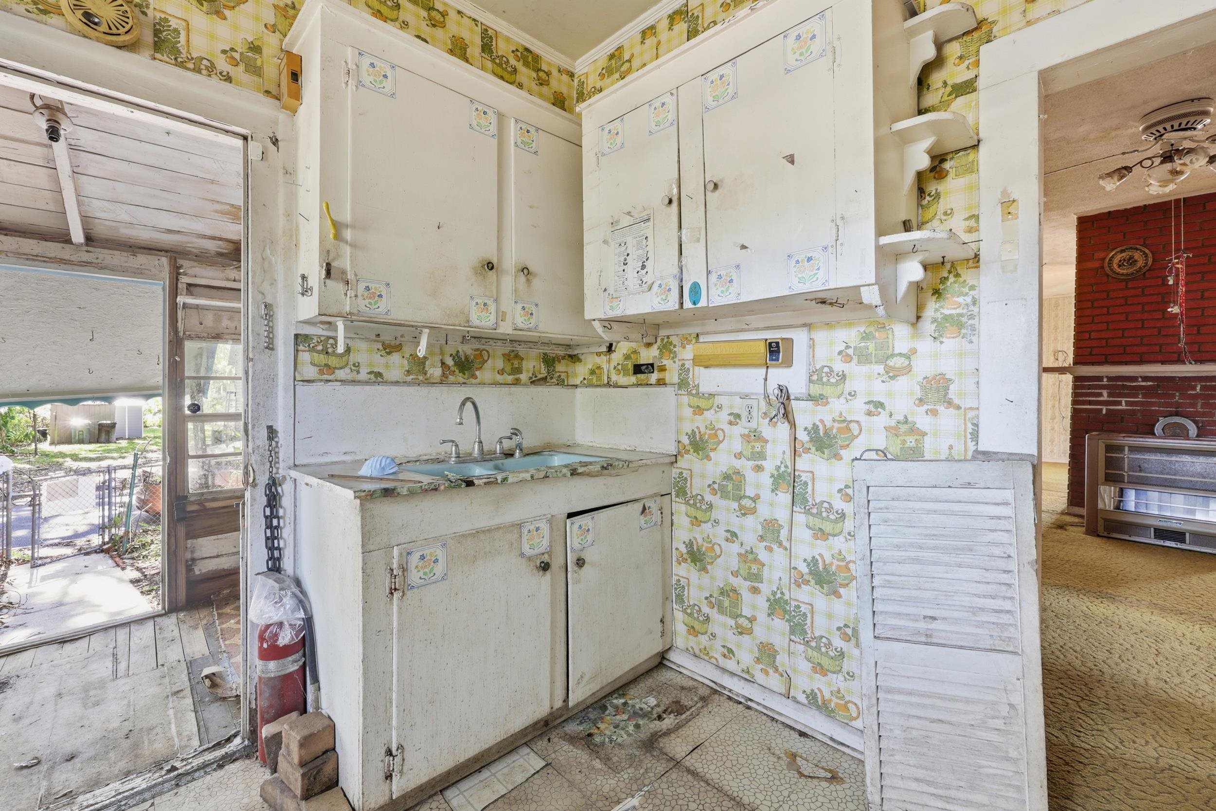 9 Masters Drive St. Augustine, FL 32084 - Photo 10 of 39 a bathroom with a granite countertop sink a mirror and shower