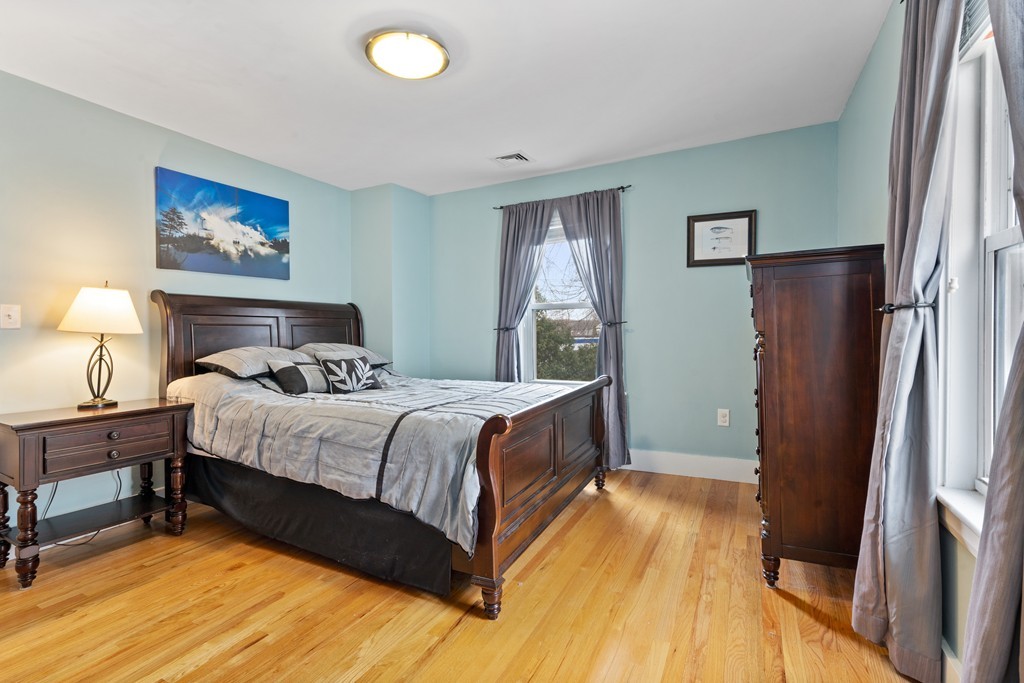 6 Porter Street, Unit 6 Woburn, MA 01801 - Photo 11 of 20 a bedroom with a bed and a flat screen tv