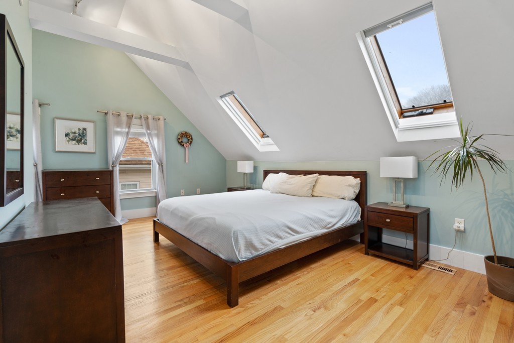 6 Porter Street, Unit 6 Woburn, MA 01801 - Photo 13 of 20 a spacious bedroom with a bed and a large mirror