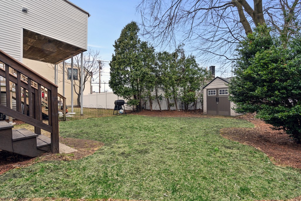 6 Porter Street, Unit 6 Woburn, MA 01801 - Photo 19 of 20 a view of a backyard with a garden