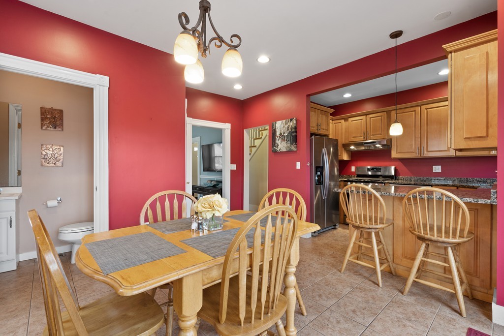 6 Porter Street, Unit 6 Woburn, MA 01801 - Photo 5 of 20 a view of a dining room with furniture