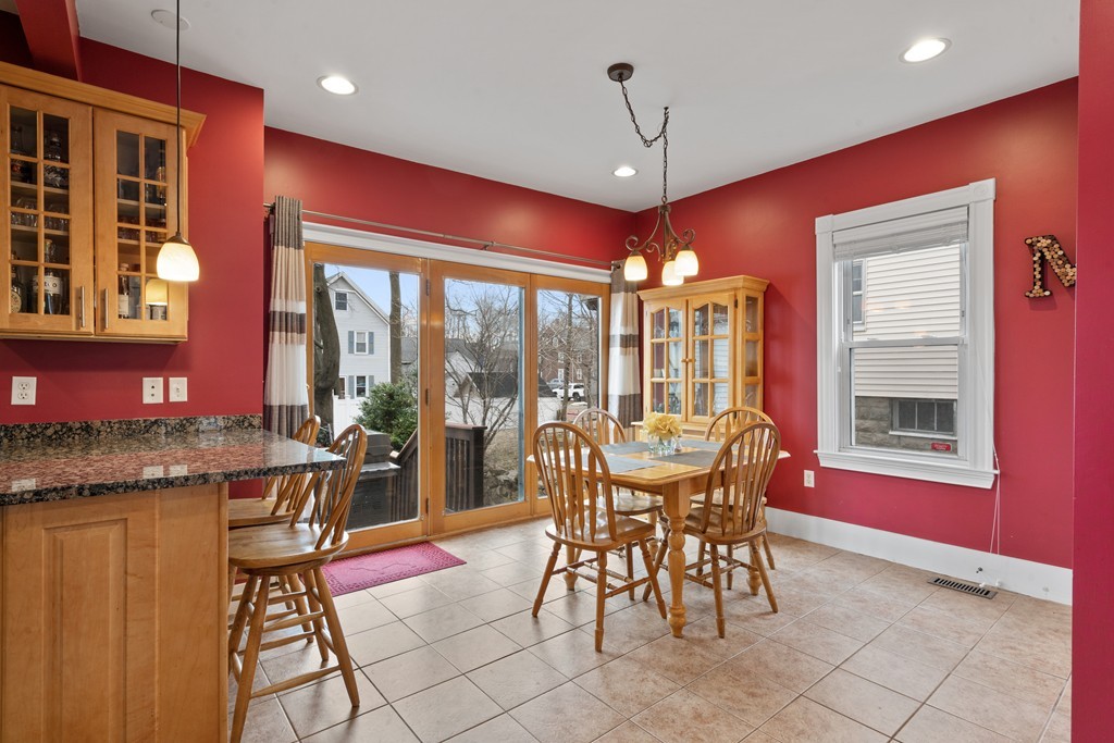 6 Porter Street, Unit 6 Woburn, MA 01801 - Photo 7 of 20 a view of a dining room with furniture window and outside view