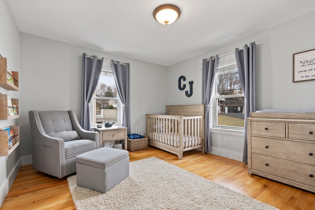 6 Porter Street, Unit 6 Woburn, MA 01801 - Photo 10 of 20 a bedroom with furniture and a window