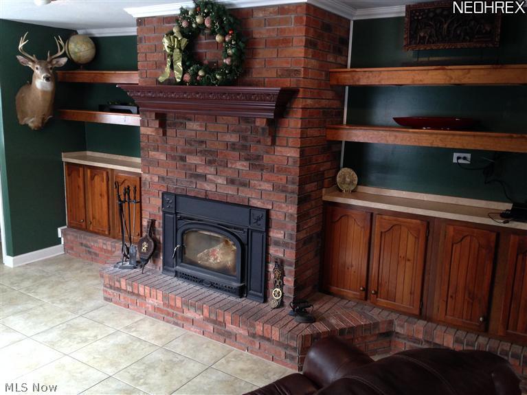 7222 West River Road Vermilion, OH 44089 - Photo 4 of 25 $4,000 Vermont Casting Wood Stove with blower. The finer things in life! Brick with beautiful cherry mantle for hanging the Christmas stockings.