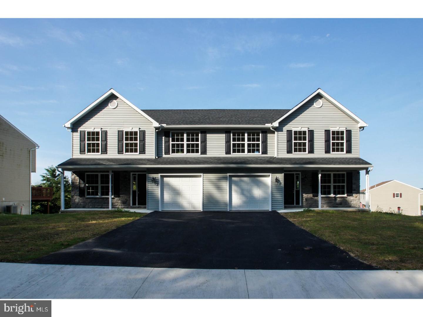 4520 Sefranka Road Temple, PA 19560 - Photo 1 of 23 a front view of a house with a yard
