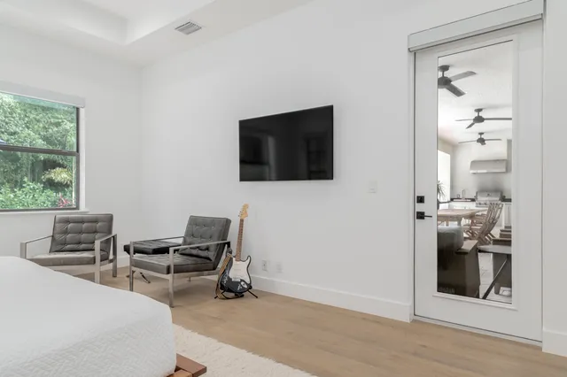 a bedroom with furniture and a window