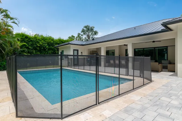 a kitchen with kitchen island a stove a sink and a refrigerator