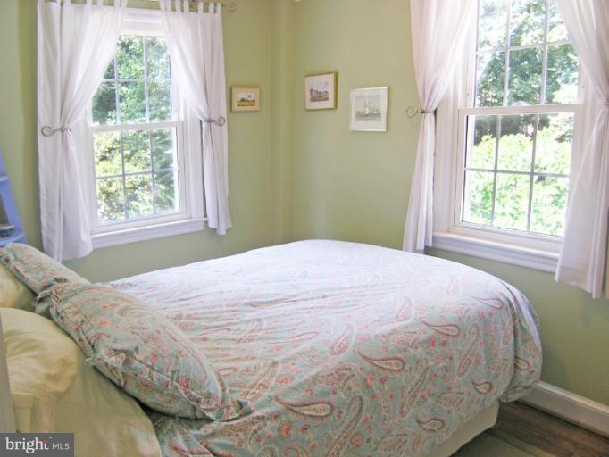 1705 Noyes Lane Silver Spring, MD 20910 - Photo 14 of 30 a large bed sitting next to a window