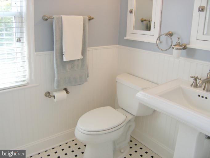 1705 Noyes Lane Silver Spring, MD 20910 - Photo 15 of 30 a bathroom with a sink a toilet and a mirror