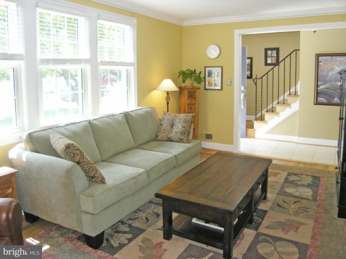 1705 Noyes Lane Silver Spring, MD 20910 - Photo 3 of 30 a living room with furniture and a large window