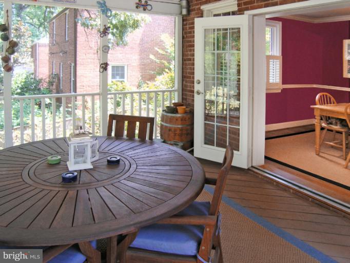 1705 Noyes Lane Silver Spring, MD 20910 - Photo 25 of 30 a view of a dining room with furniture wooden floor and a potted plant