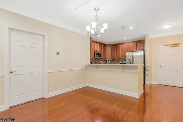 a view of a kitchen with a sink and cabinets