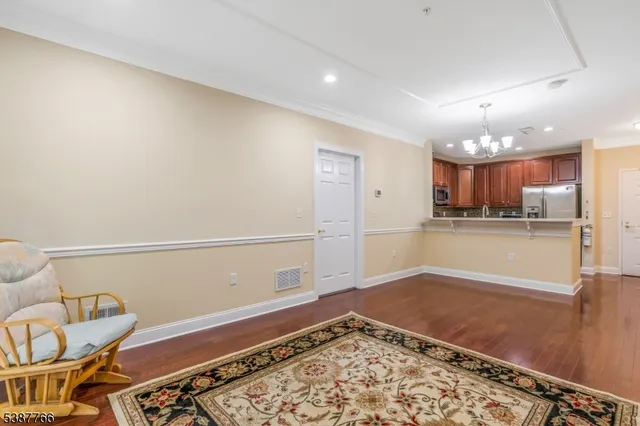 a view of kitchen and dining room with wooden floor