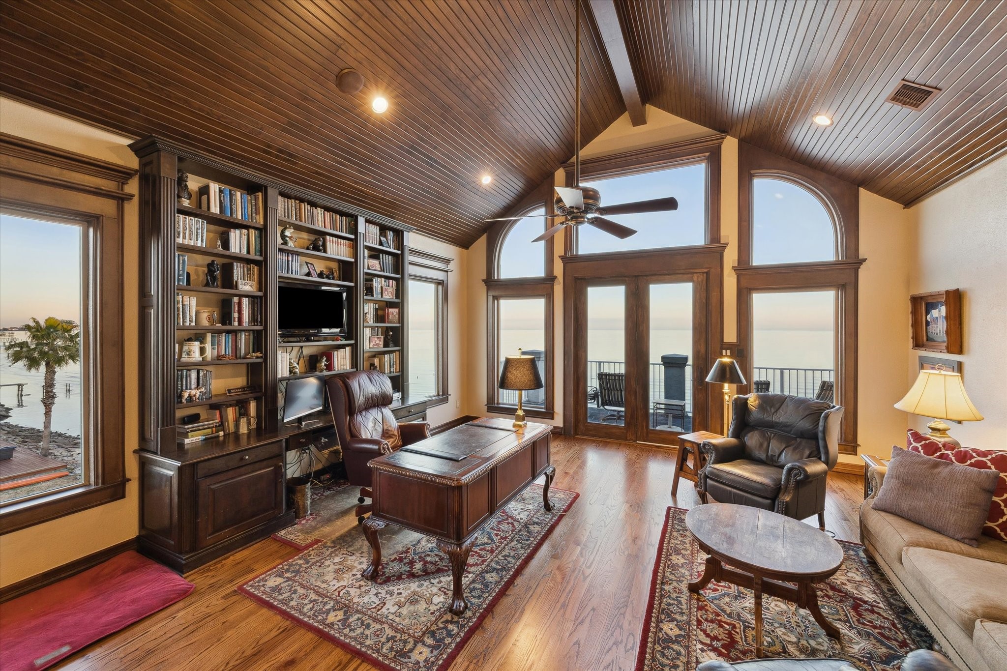 1406 Todville Road Seabrook, TX 77586 - Photo 30 of 50 2ND LEVEL GAMEROOM WITH FRENCH DOOR OPENING TO AN AMAZING BALCONY, CUSTOM BUILT-INS OFFER BOTH A CONVENIENT DESK AND ENTERTAINMENT CENTER.
