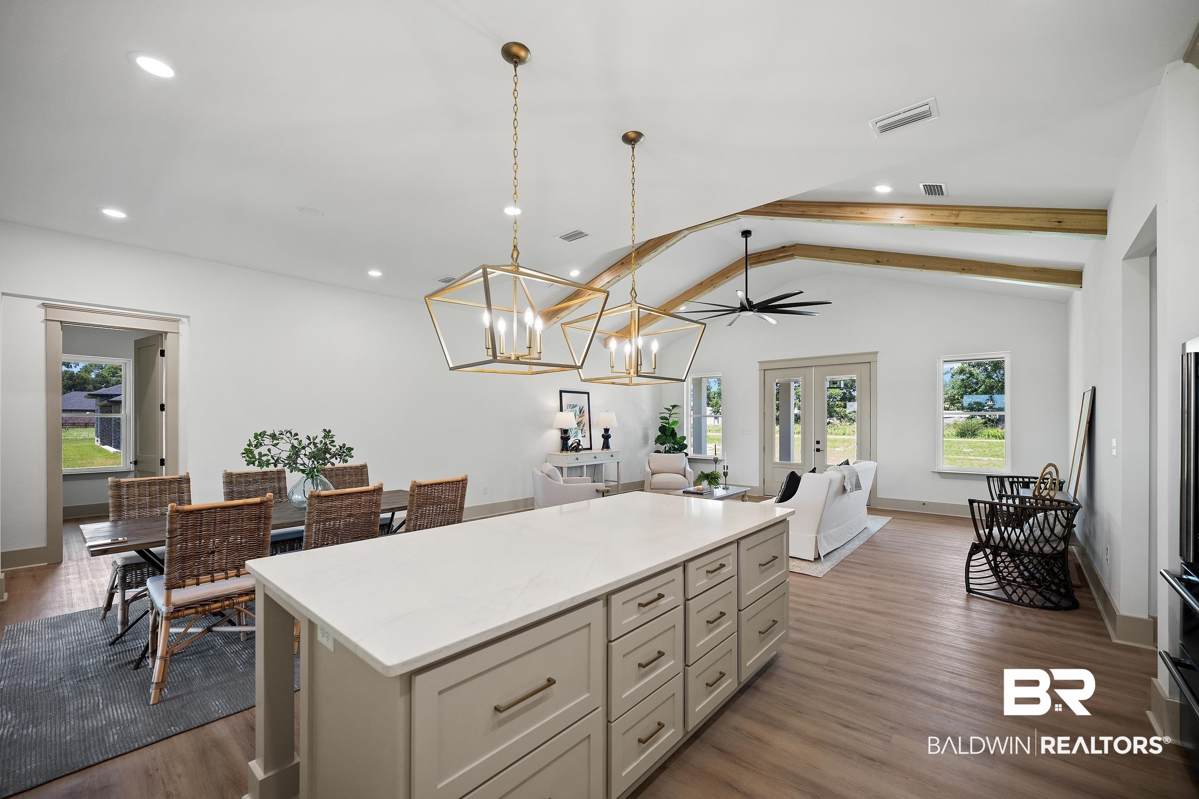 13111 Gopher Court Elberta, AL 36530 - Photo 12 of 41 Kitchen island with a light-toned countertop and ample storage cabinetry
