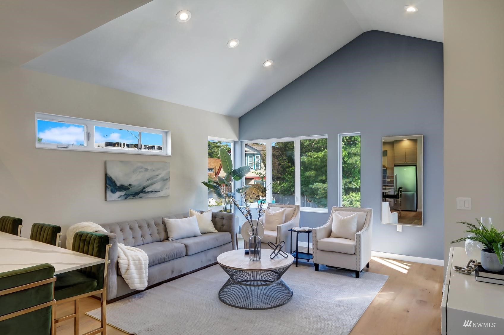 6525 Chapin Place North Seattle, WA 98103 - Photo 11 of 35 a living room with furniture and a large window