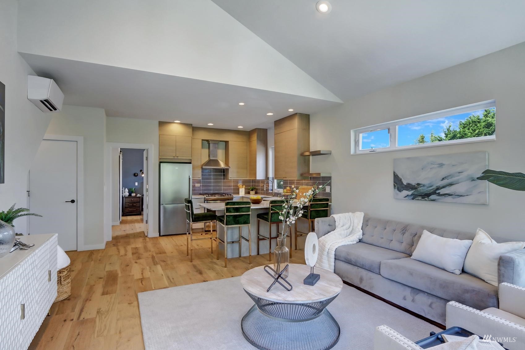 6525 Chapin Place North Seattle, WA 98103 - Photo 12 of 35 a living room with furniture kitchen view and a large window