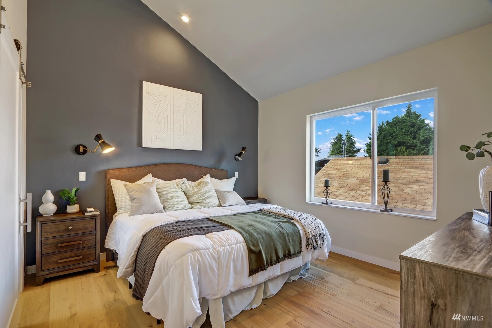6525 Chapin Place North Seattle, WA 98103 - Photo 15 of 35 a bedroom with a bed and wooden floor