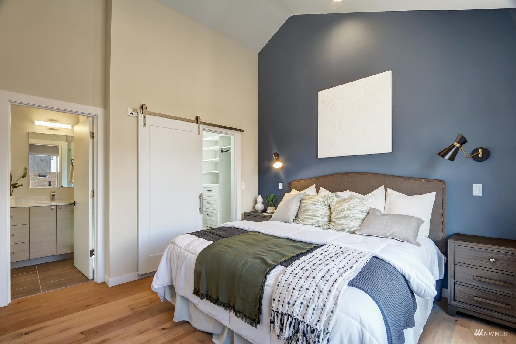 6525 Chapin Place North Seattle, WA 98103 - Photo 16 of 35 a bedroom with a bed and a mirror