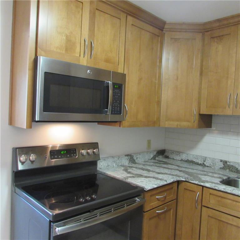 730 Rodney Street Crescent, PA 15046 - Photo 9 of 25 Newer Kitchen Quartz Countertops 5 Burner Electric Cooktop. Confection Oven