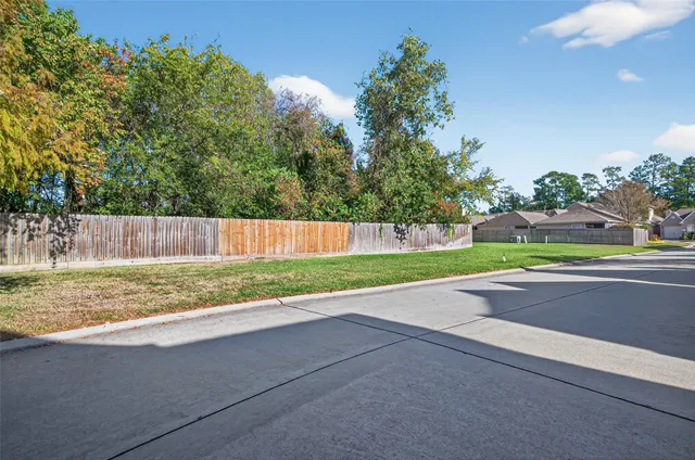 a view of a yard with a tree