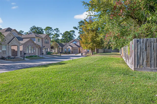 a view of a house with a yard and table and chair