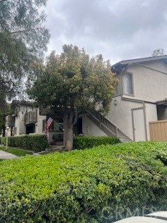 48 Clearbrook, Unit 56 Irvine, CA 92614 - Photo 1 of 6 a view of a house with a yard
