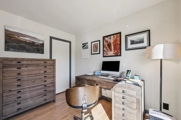 a view of a workspace with furniture