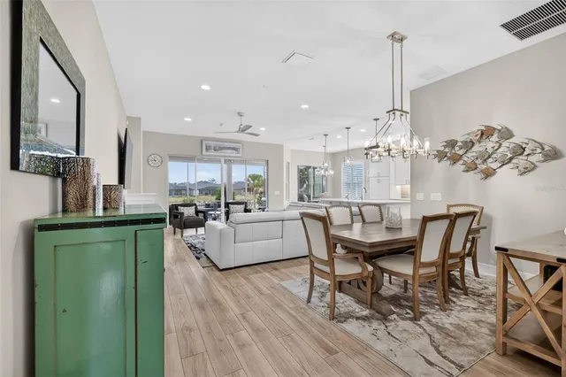 a dining room with furniture and wooden floor