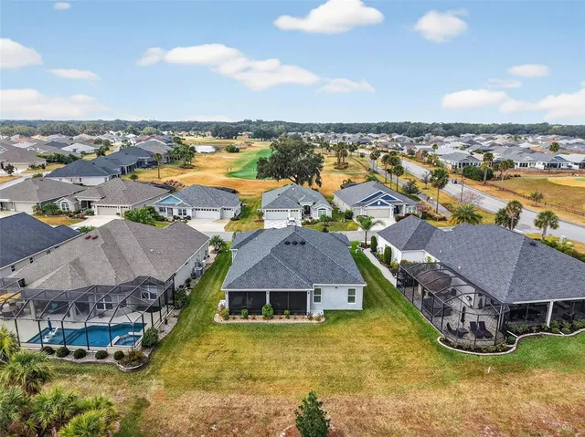 a aerial view of a house with a ocean view