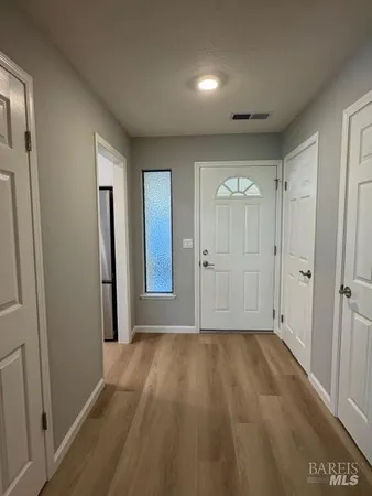 a view of an empty room and closet area