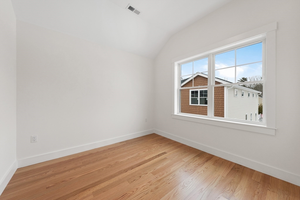 2 Old County Road, Unit 10 Salisbury, MA 01952 - Photo 13 of 27 an empty room with wooden floor and windows