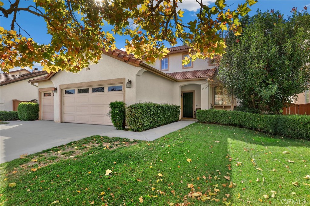 33115 Fox Road Temecula, CA 92592 - Photo 1 of 1 a front view of a house with a garden