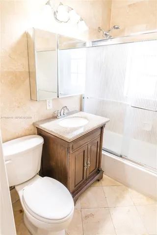 a bathroom with a toilet a sink and a bathtub