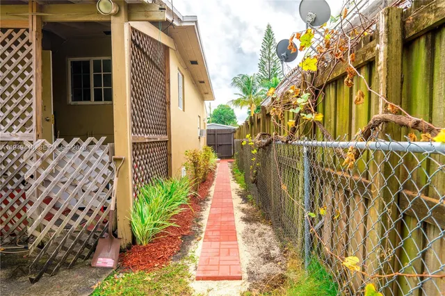 a narrow alley leading to a building