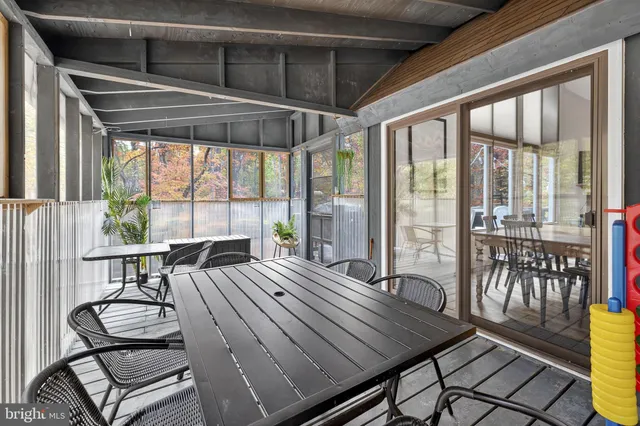 a living room with furniture fireplace and a table