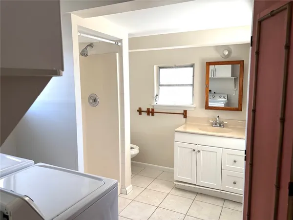 a view of an empty room with a window