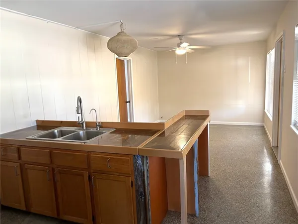 a kitchen with a sink and a window
