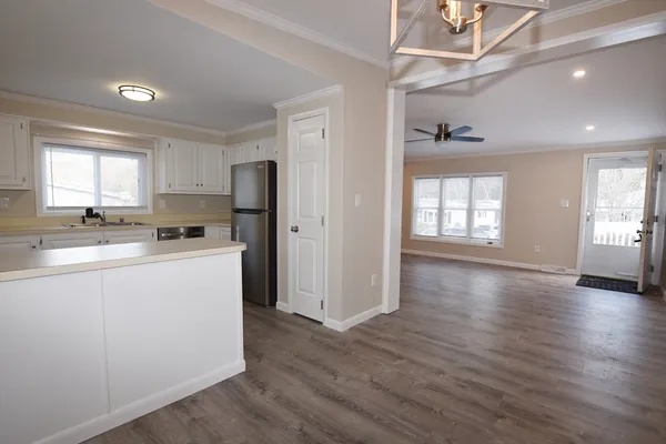 a kitchen with refrigerator and window