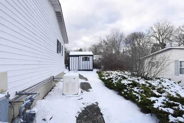 a view of a patio with wooden fence