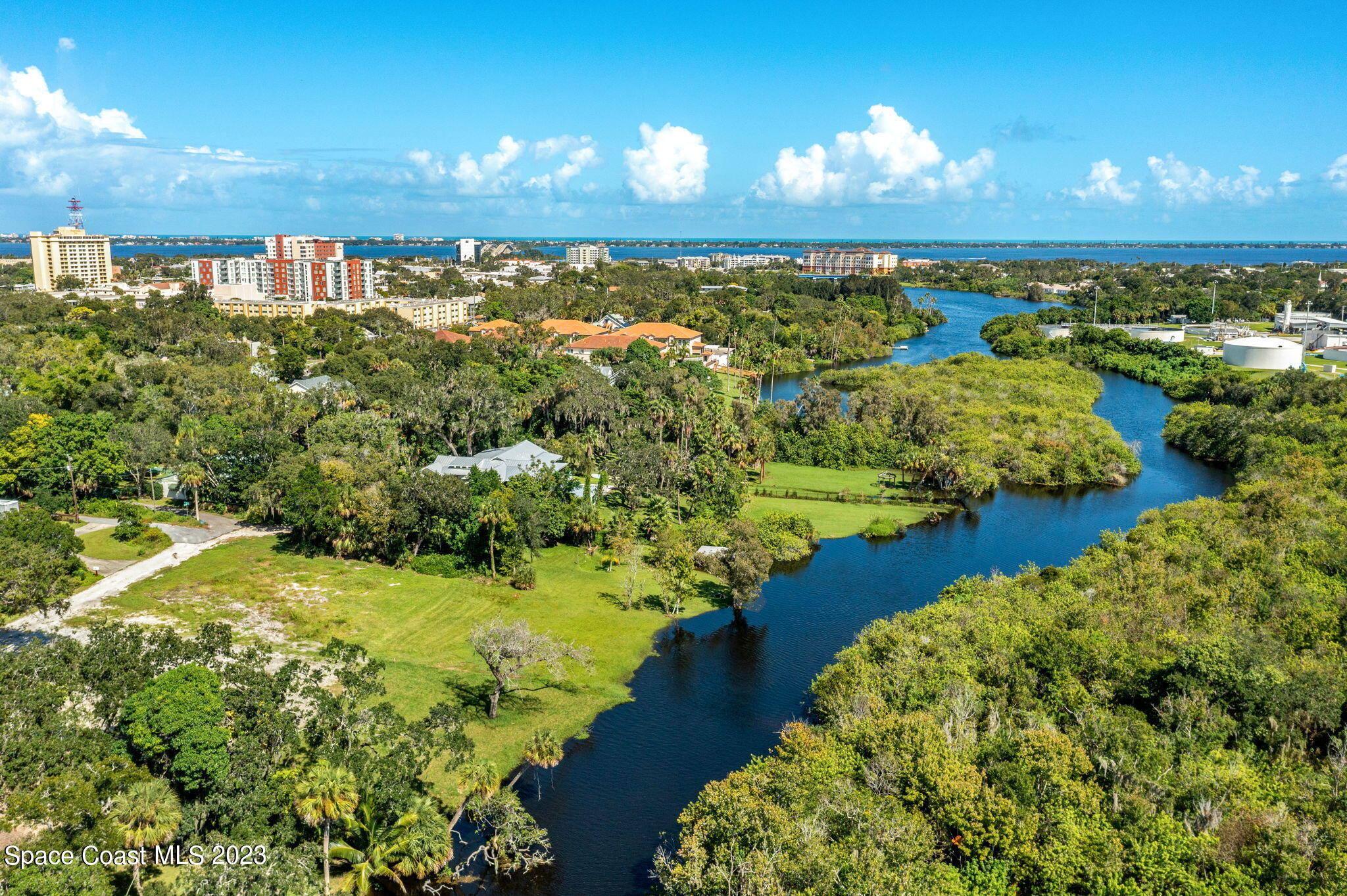 409 Roxy Avenue Melbourne, FL 32901 - Photo 11 of 31 a view of a lake with a yard