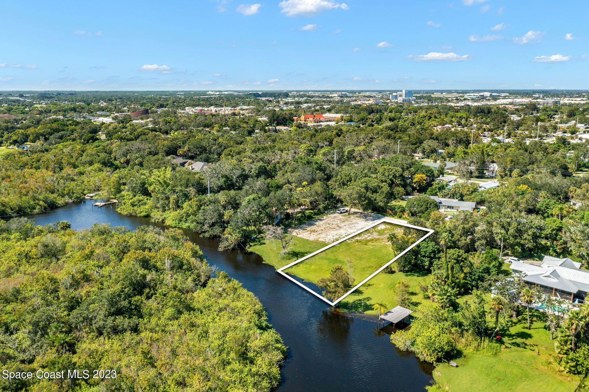 409 Roxy Avenue Melbourne, FL 32901 - Photo 2 of 31 an aerial view of a residential houses with outdoor space and trees