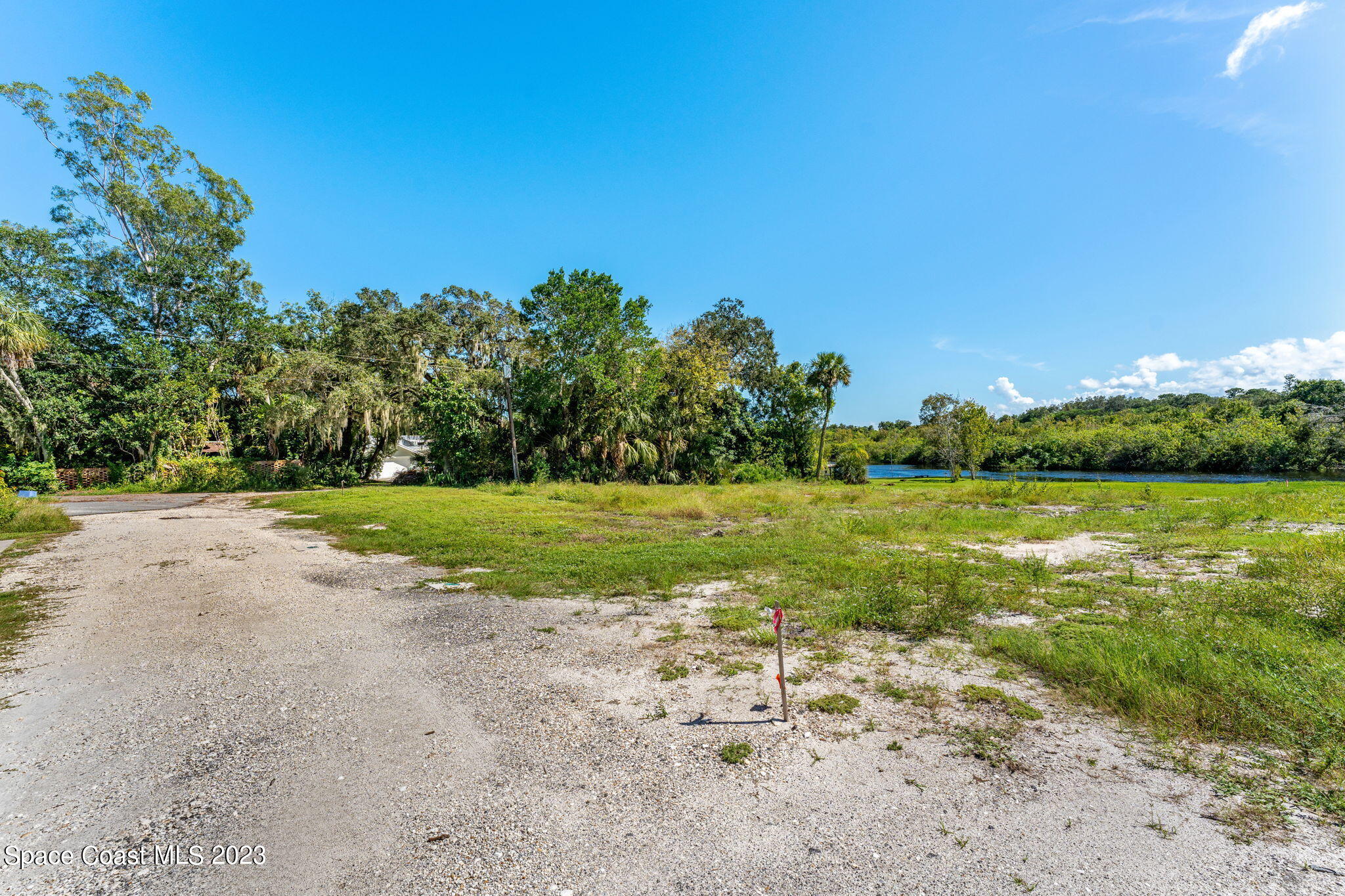 409 Roxy Avenue Melbourne, FL 32901 - Photo 22 of 31 a view of a lake with a yard
