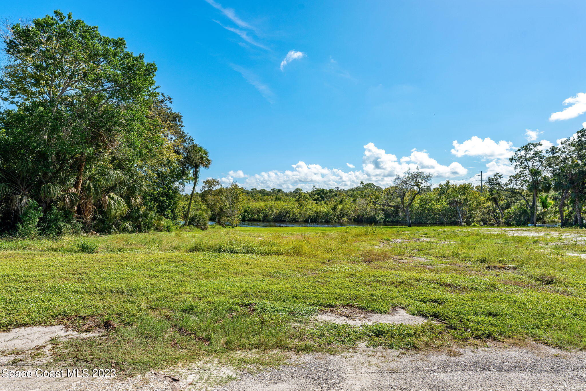 409 Roxy Avenue Melbourne, FL 32901 - Photo 23 of 31 a view of a field with an trees